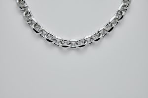 silver necklace on white background